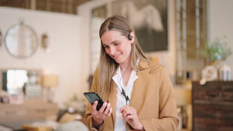 associate smiles at phone while camera orbits through store aisle