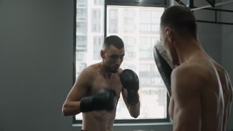 boxing and kickboxing training session in gym