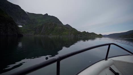 front view from a boat through a mountain lake in norway - wide