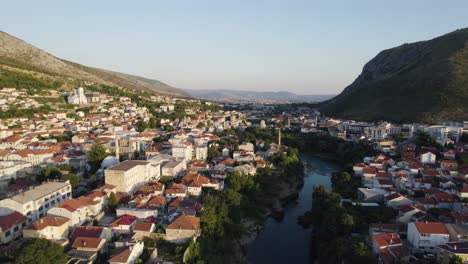 historic mostar cityscape at dusk, bosnia - aerial flyover