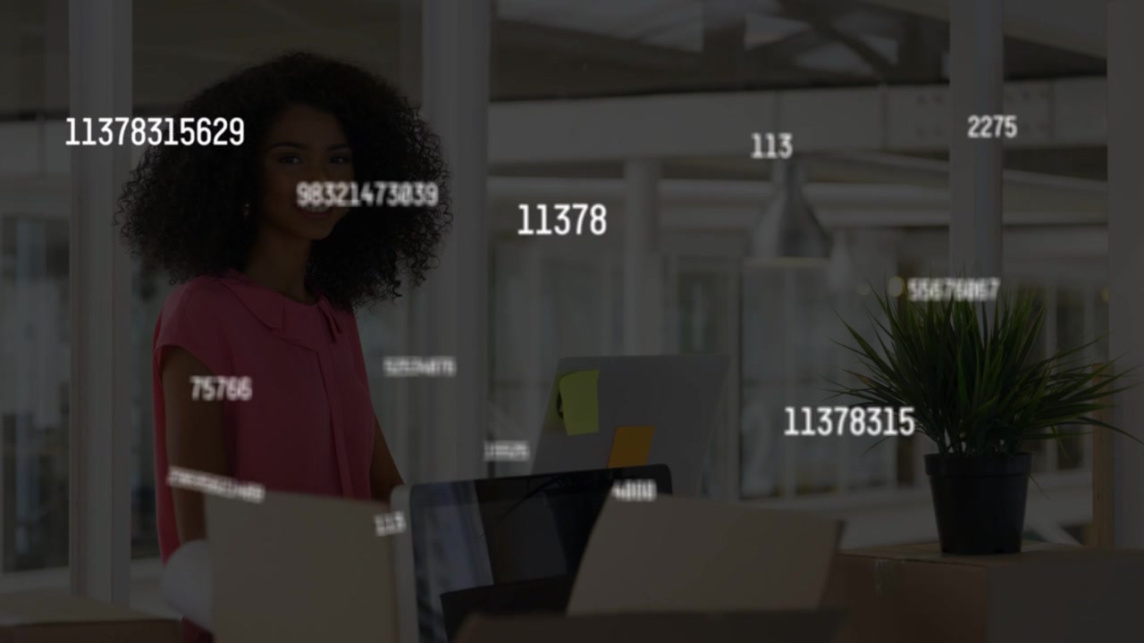 Woman at desk receiving feed, watching floating numbers growing then fading, smiling for analytics
