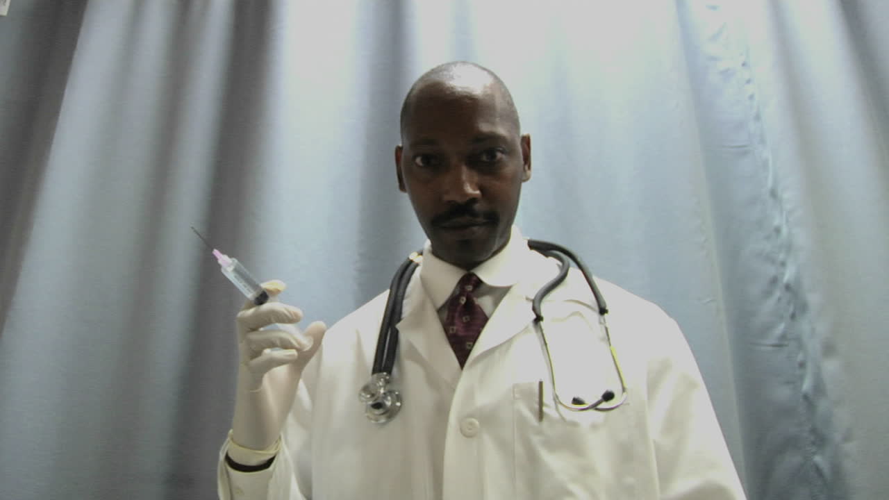 A doctor prepares to administer an injection with a needle