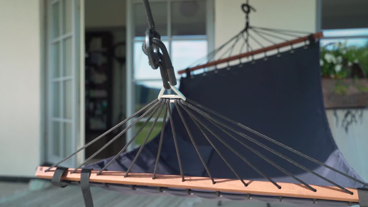 Hammock Sway In Slow Motion On Cosy Porch. Slow Dolly Foward