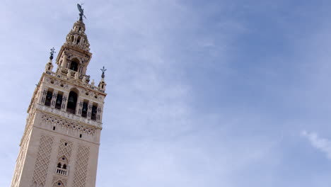 the giralda bell tower of seville cathedral in seville, 16th-century belfry at the top of the giralda tower, spain