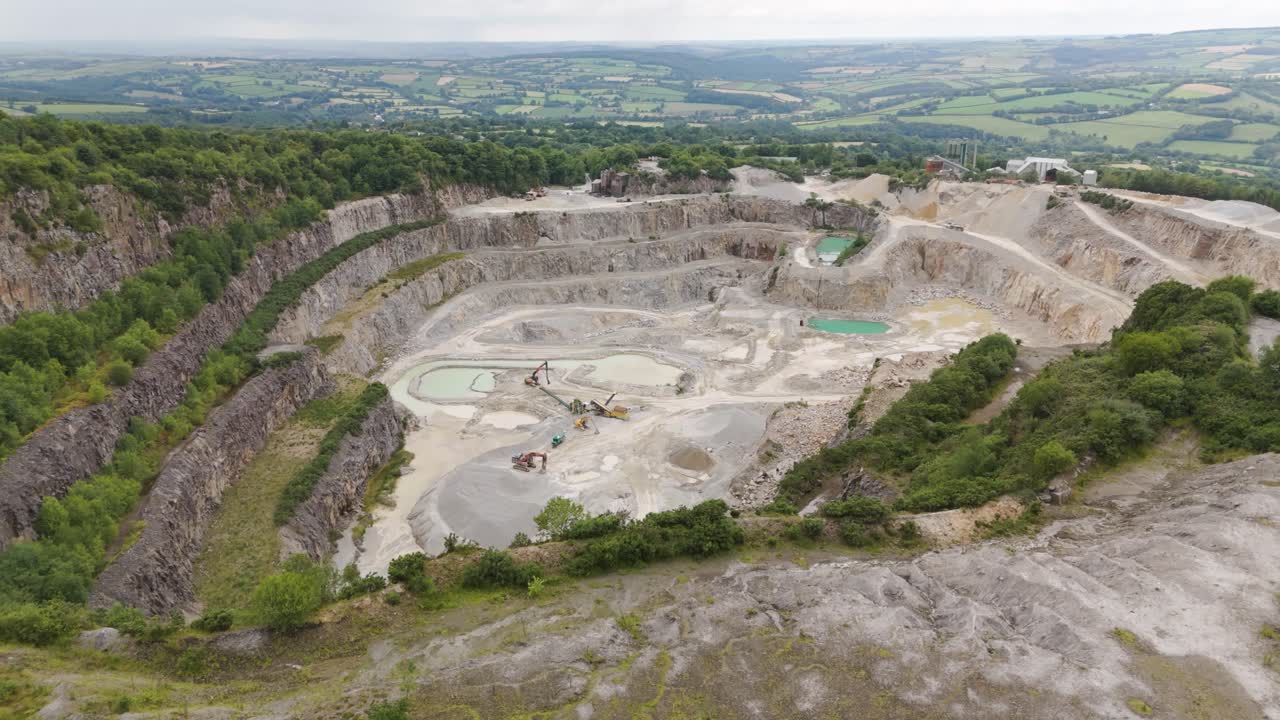 Aerial View of an Active Open-Pit Quarry with Heavy Machinery
