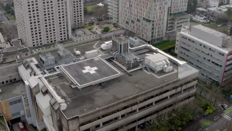 fly over a helipad at vancouver general hospital in canada - aerial shot