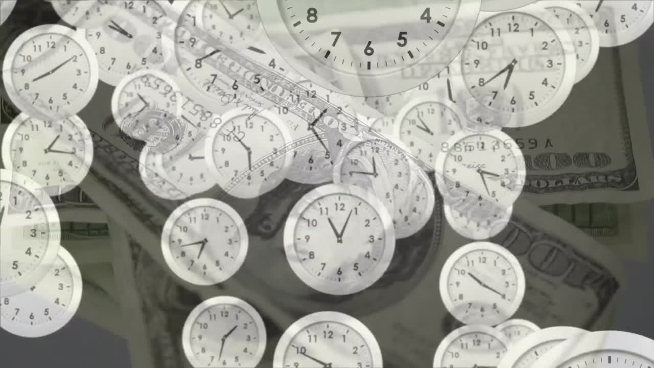 Animation of clocks ticking over american dollar currency banknotes