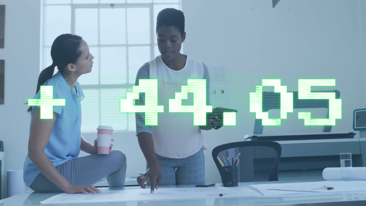 Animation of stock market data processing against two diverse women discussing over a plan at office