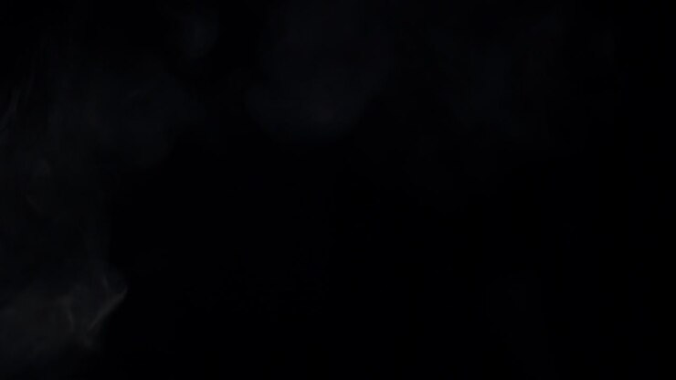 White Smoke or Vapor Expanding and Dissipating on Black Background