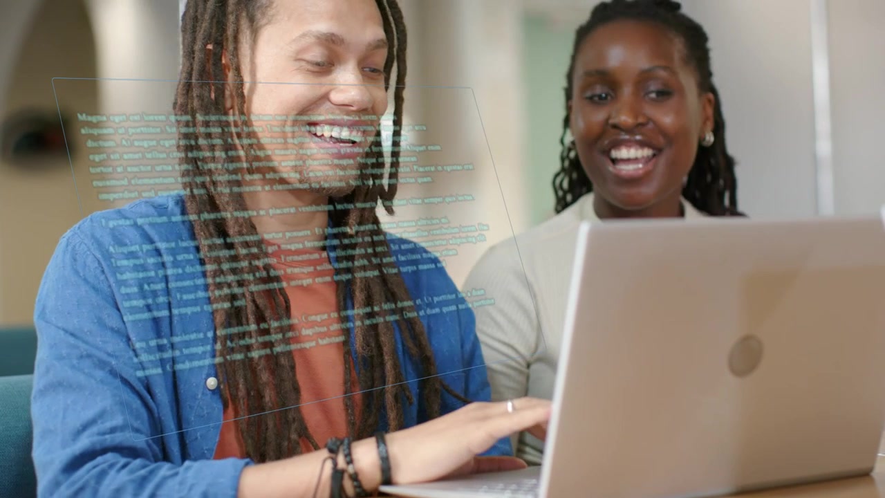 Man typing on laptop after glancing, woman leaning in pointing, code overlay showing tech work