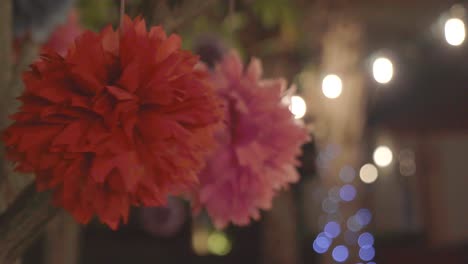 colorful adorn flower swing on tree in garden.