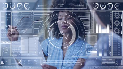 Animation-of-data-processing-on-screen-over-african-american-businesswoman