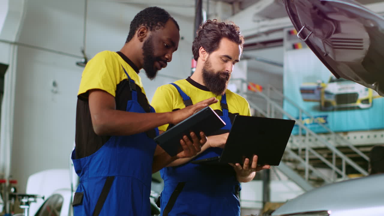 Mechanics in car service order new parts