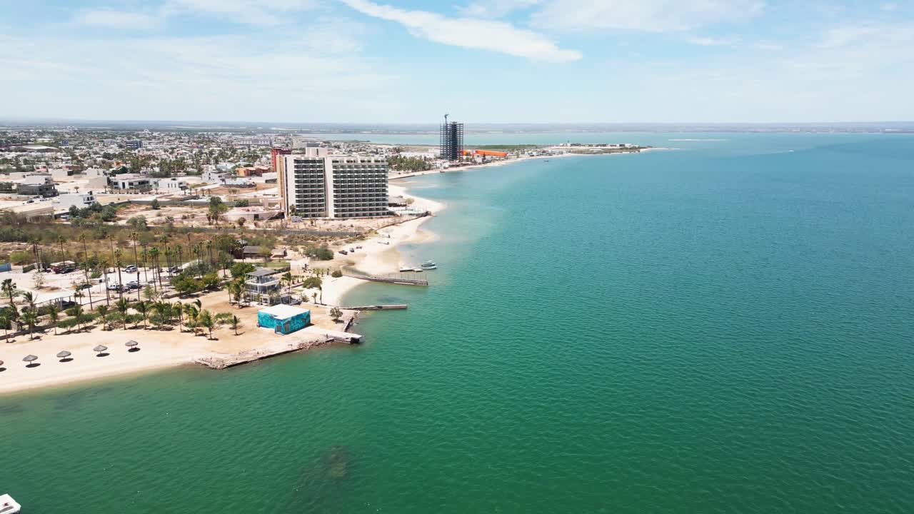 La paz beach, calm turquoise sea, and quiet hotel coast in mexico, aerial view