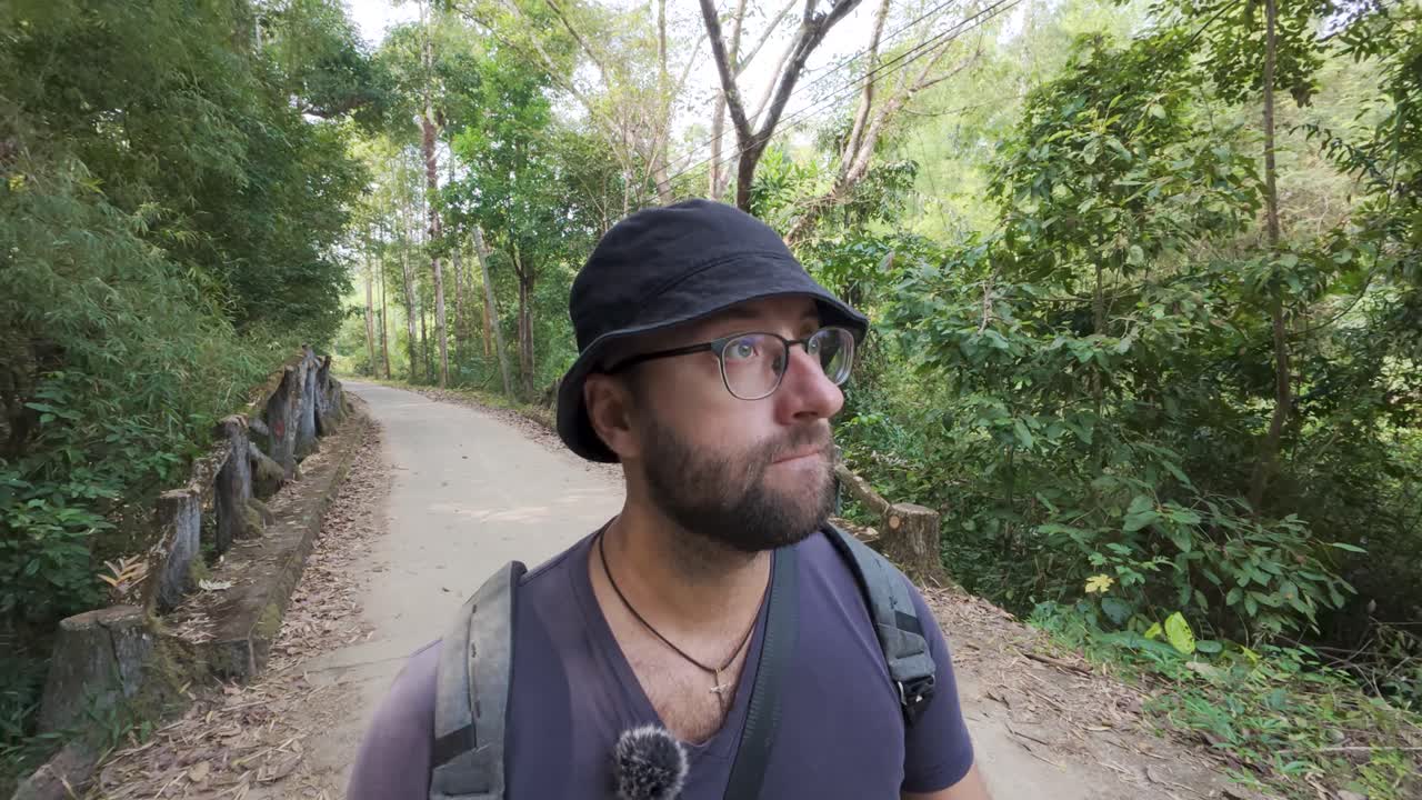 Alone he walks where silence grows, through shaded paths no one goes