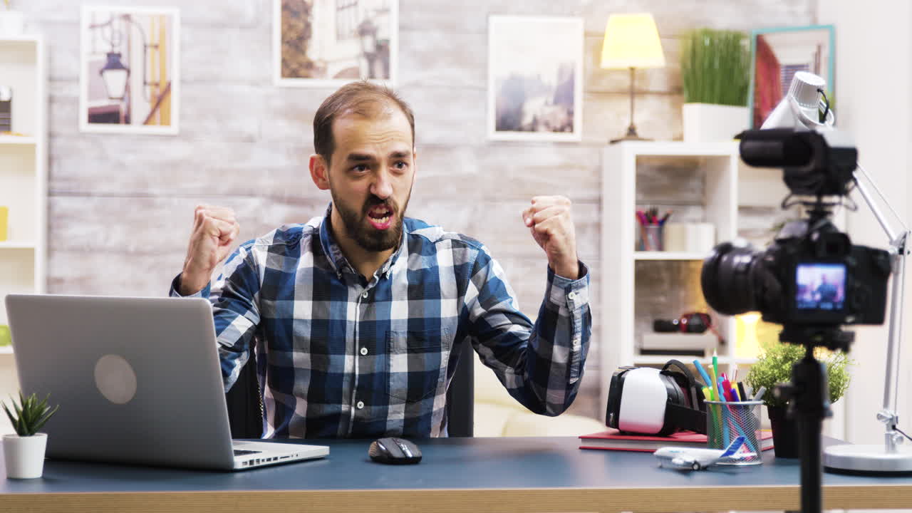 Man celebrating success at desk