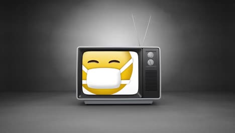 Digital-animation-of-face-wearing-mask-emoji-on-television-screen-against-grey-background