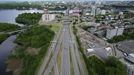 Aerial-view-backwards-over-the-Quebec-Autoroute-5,-in-sunny-Gatineau,-Canada