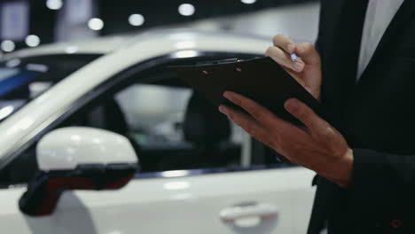salesman reviewing car details
