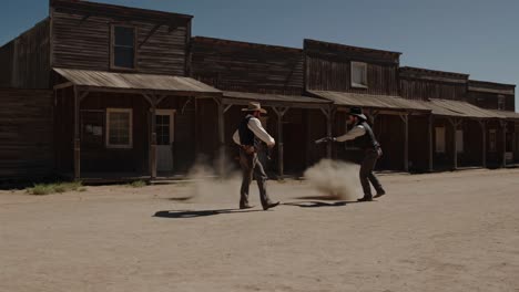 two cowboys in a dust-filled shootout in the old west