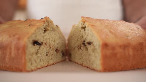 separate chocolate chip bread loaf halves apart, showing tasty dessert, close up