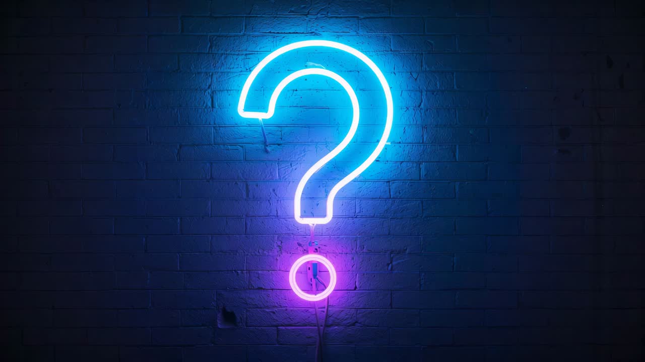 Experiencing power outage, neon tube question mark sign flickering and glowing against brick wall