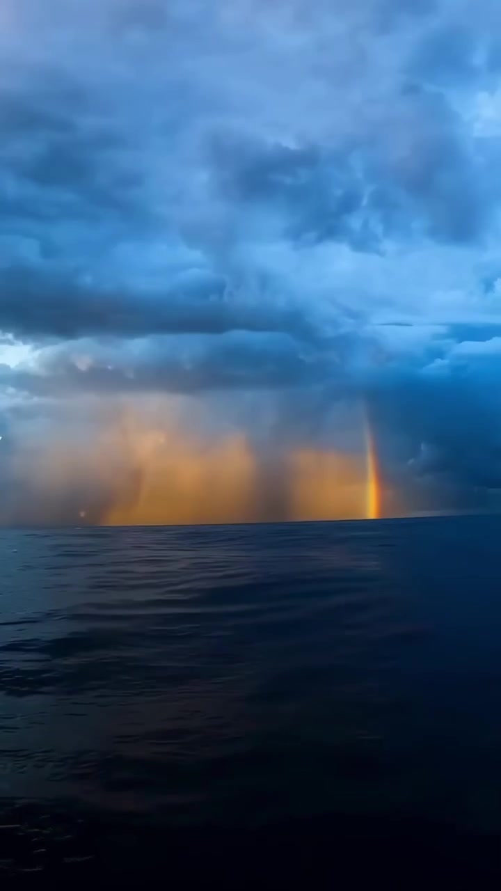 Ocean Waves Crashing Under Dramatic Stormy Sunset Sky