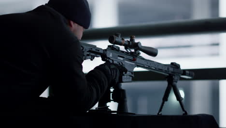 Killer-with-assault-rifle-at-position.-Hitman-using-rifle-with-telescopic-sight