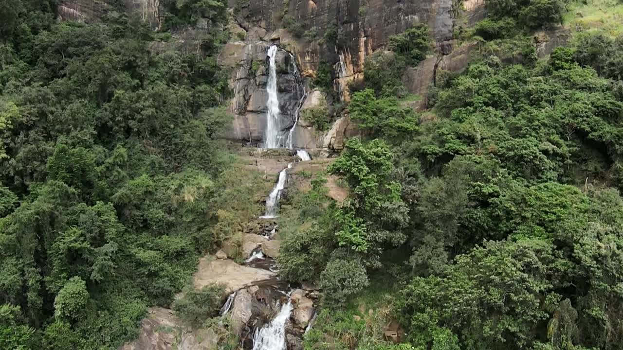 Aerial cinematic landscape of Ravana Waterfall, Sri Lanka