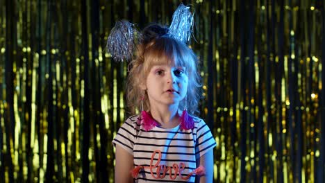 futuristic hipster teen girl showing thumbs up in slow motion at disco party club in blue neon light