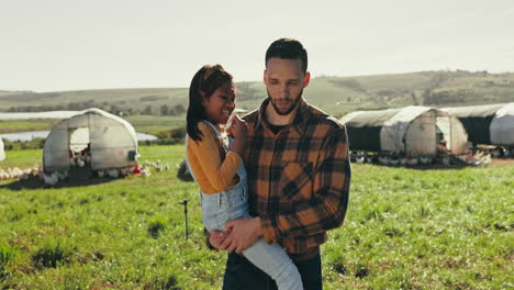 Man-carrying-child-on-farm