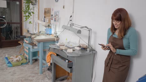 jeweler working in her studio