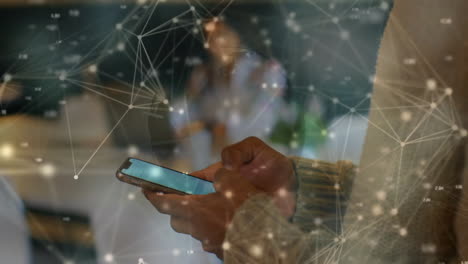 holding smartphone, person with network connections animation in background