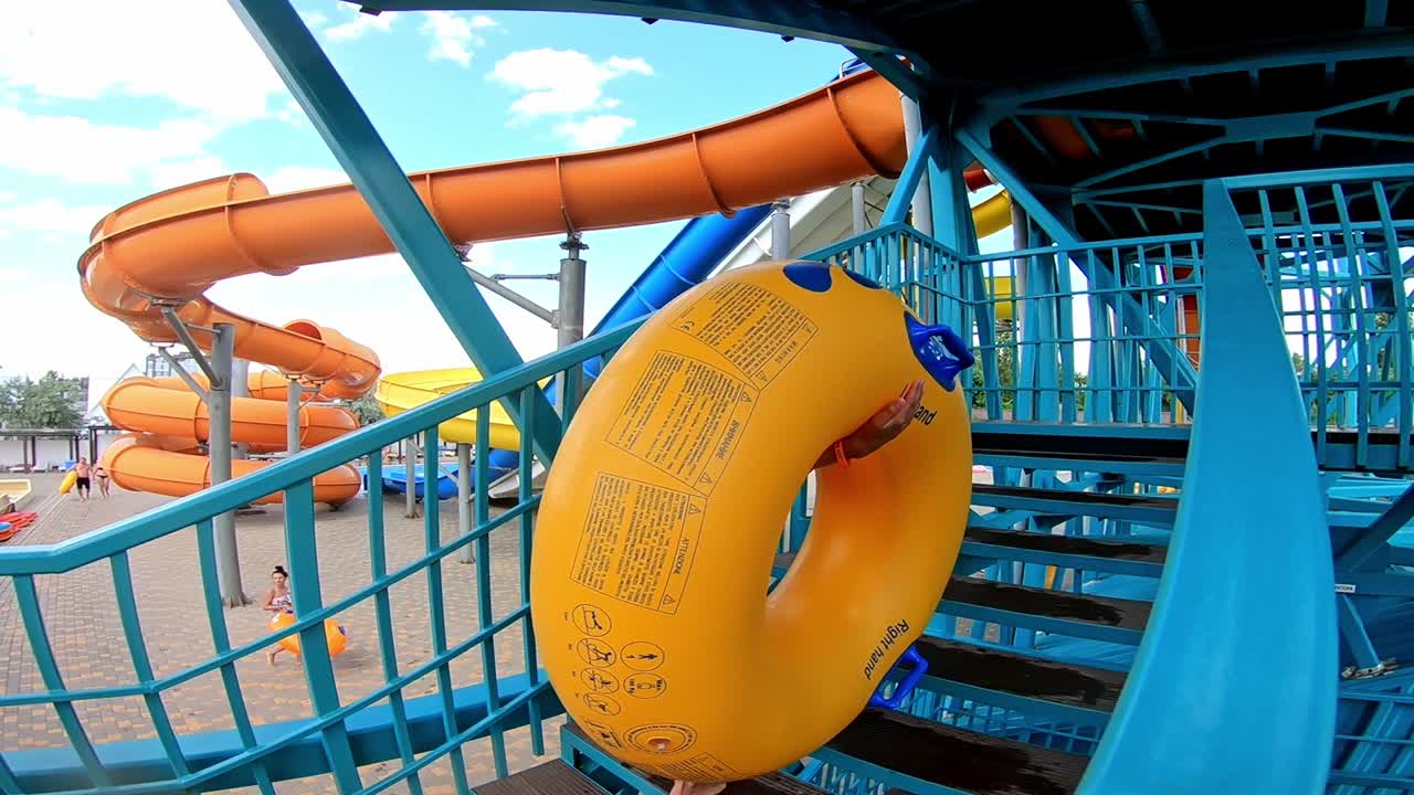 teen boy having fun in water park