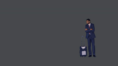 Businessman-standing-with-arms-crossed-with-his-luggage