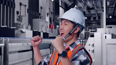 Close Up Of Side View Of Asian Male Engineer With Safety Helmet Screaming Goal Celebrating Working With Water Production in Bottling Factory