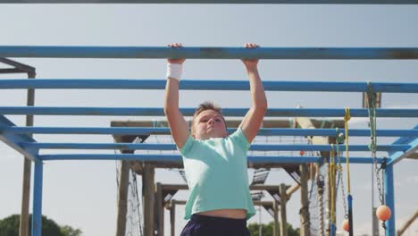 Caucasian boy training at boot camp