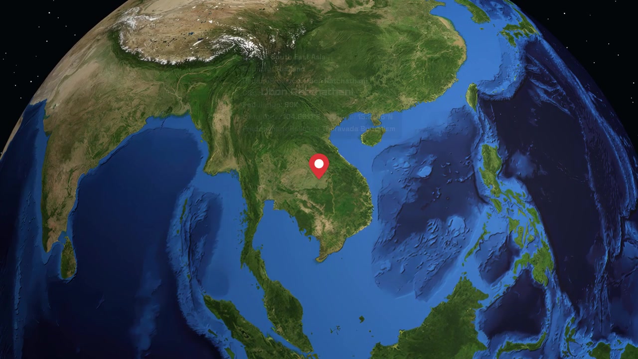 A digital camera zooms from space into Thailand, highlighting Ubon Ratchathani with location data