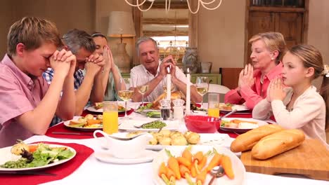 three generation family having christmas dinner together