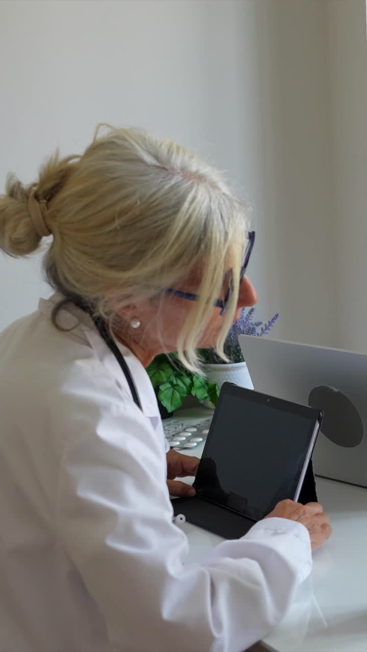 Medical Professionals Meeting with Laptop and Tablet