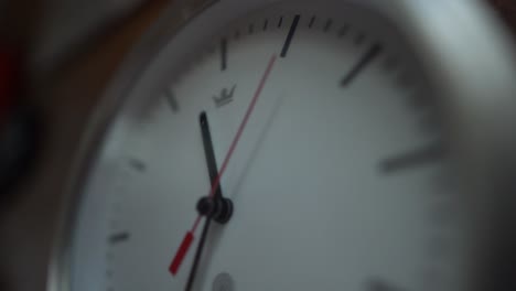 white clock ticking showing time pass by