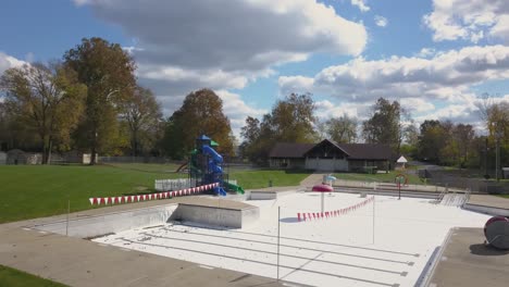 closed empty water park and slides with splash areas recreational water play space shut down or abandoned during the fall season or covid 19