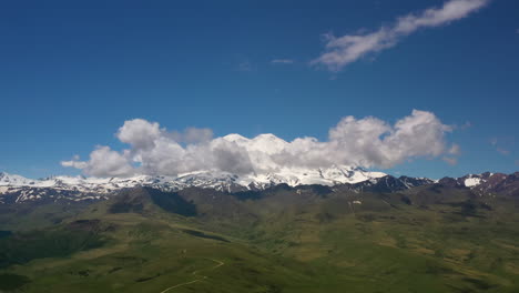 elbrus region. flying over a highland plateau. beautiful landscape of nature. mount elbrus is visible in the background.