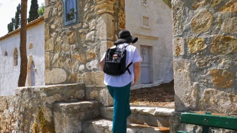 female tourist exploring the village of asos in kefalonia island in greece at summer