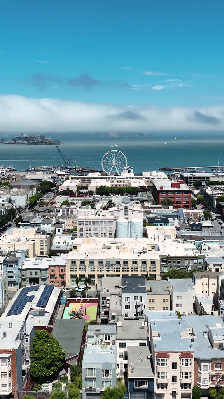 Vertical View Of Waterfront Cityscape With SkyStar Wheel Fisherman’s Wharf In San Francisco, California, United States. Aerial Shot