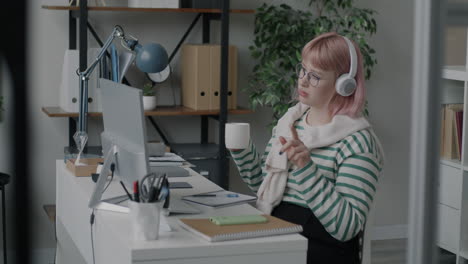 woman in a home office on a video call