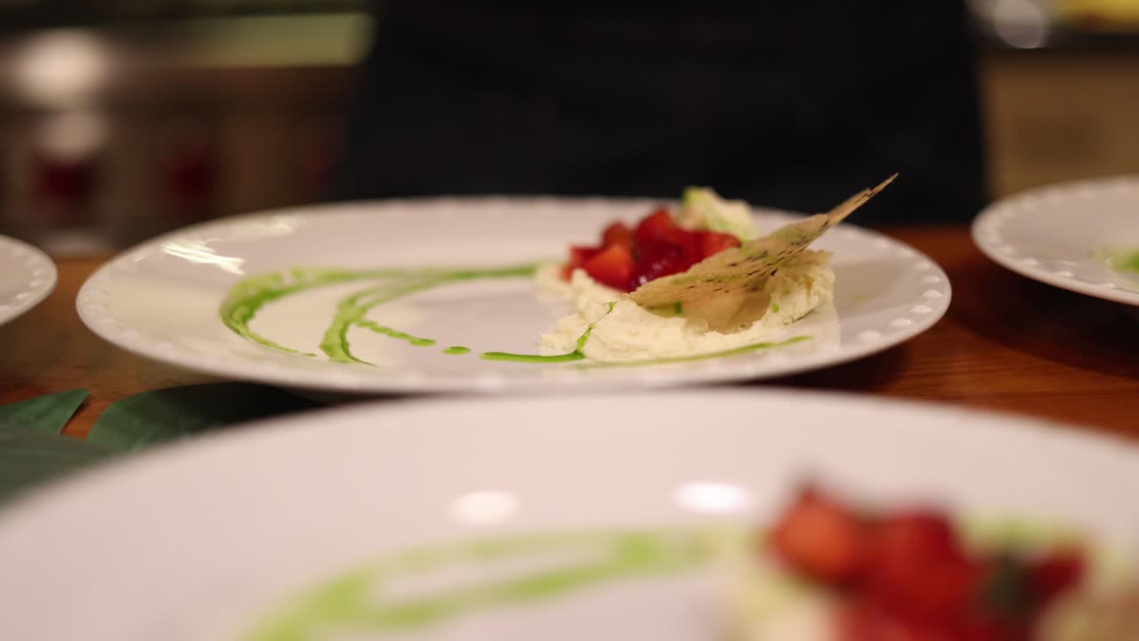 Close-up of plated dessert with strawberries and cream