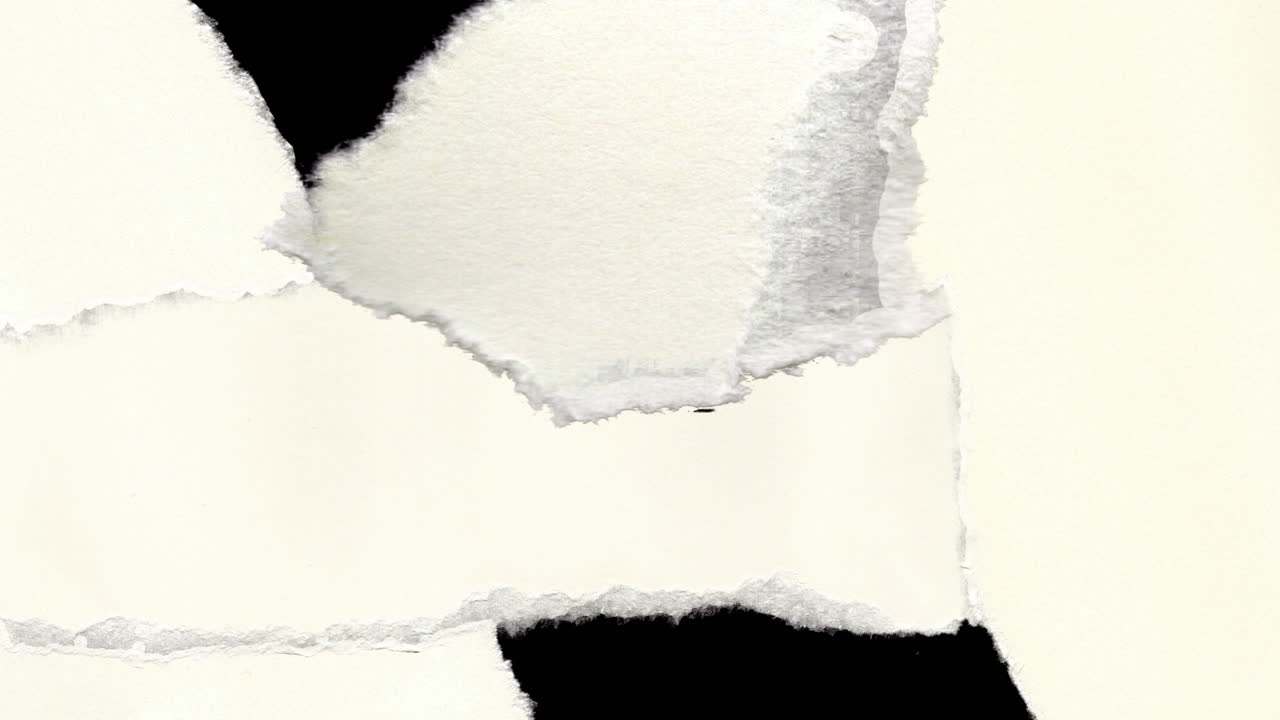Torn White Paper Pieces Appearing and Disappearing on Black Background