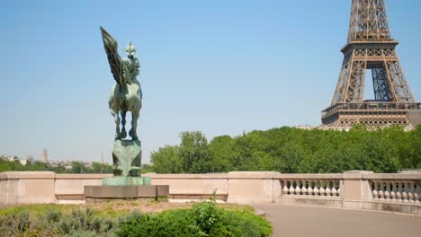 equestrian statue of monument de la france renaissante at bir-hakeim bridge with a view of eiffel tower in paris, france