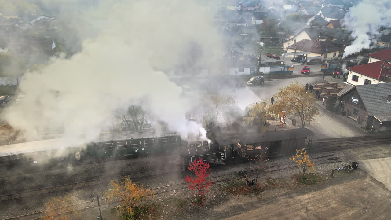 Aerial drone view of the wound-up steam train Mocanita at the railway station in Viseu de Sus, Romania